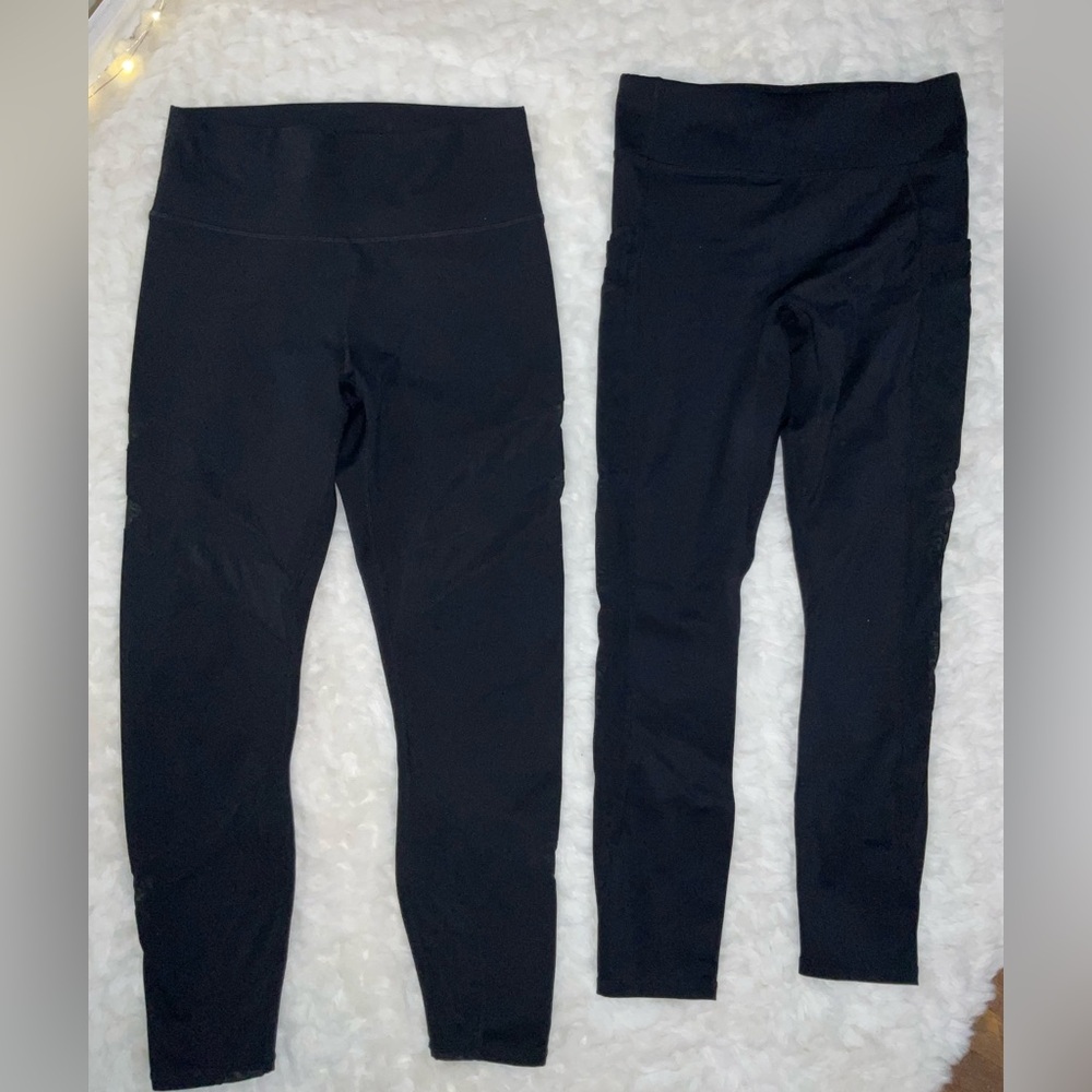 Two pair all black Fabletics leggings with mesh details